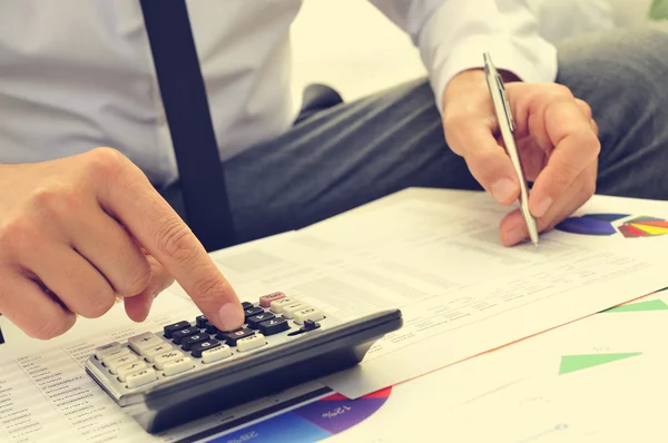 Young man checking accounts — Stock Photo, Image