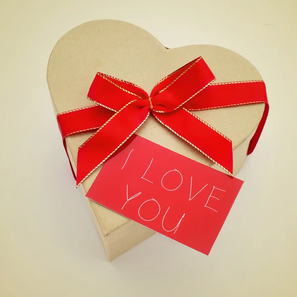 Heart-shaped gift box and signboard with the text I love you — Stock Photo, Image