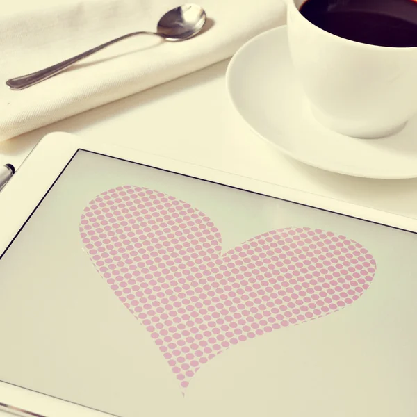 Heart in a tablet — Stock Photo, Image