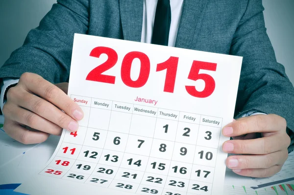 Young businessman with a 2015 calendar — Stock Photo, Image
