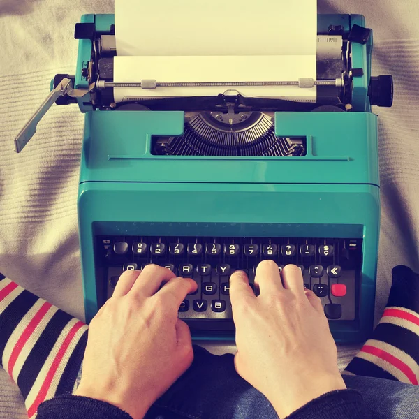 Young man typewriting, with a retro effect — Stock Photo, Image
