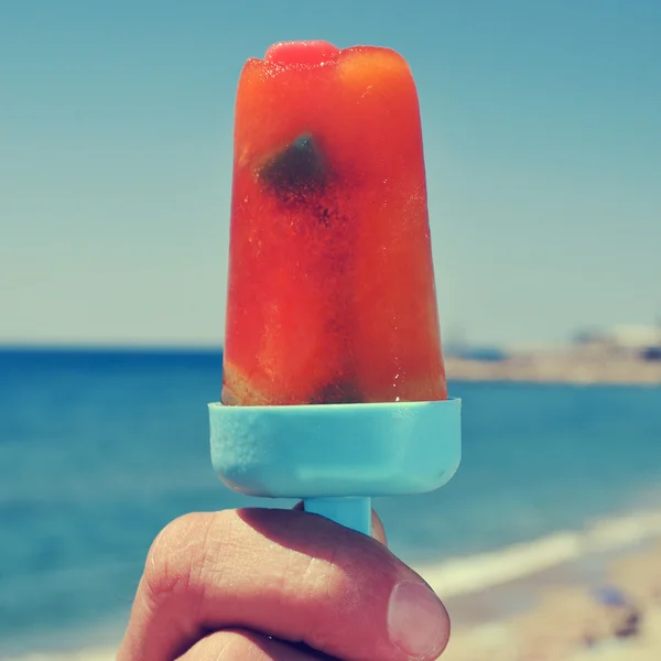 Homemade ice pop on the beach, with a filter effect — Stock Photo, Image