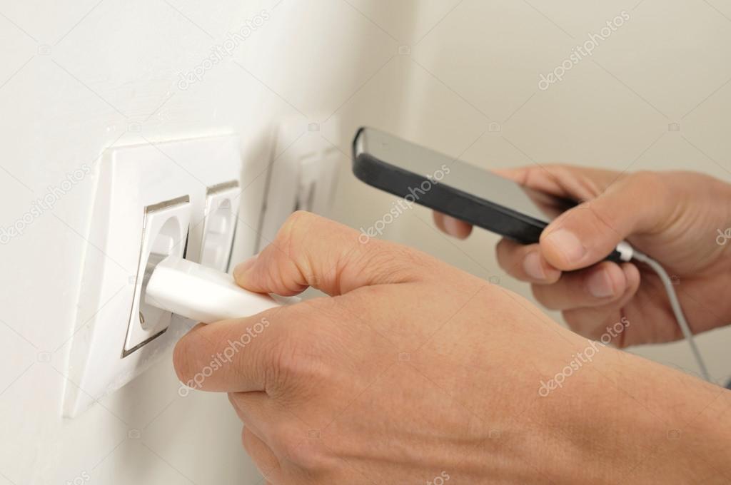 Man charging phone