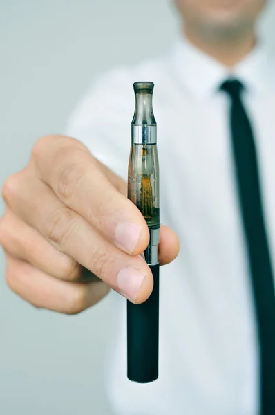 Man showing an electronic cigarette — Stock Photo, Image