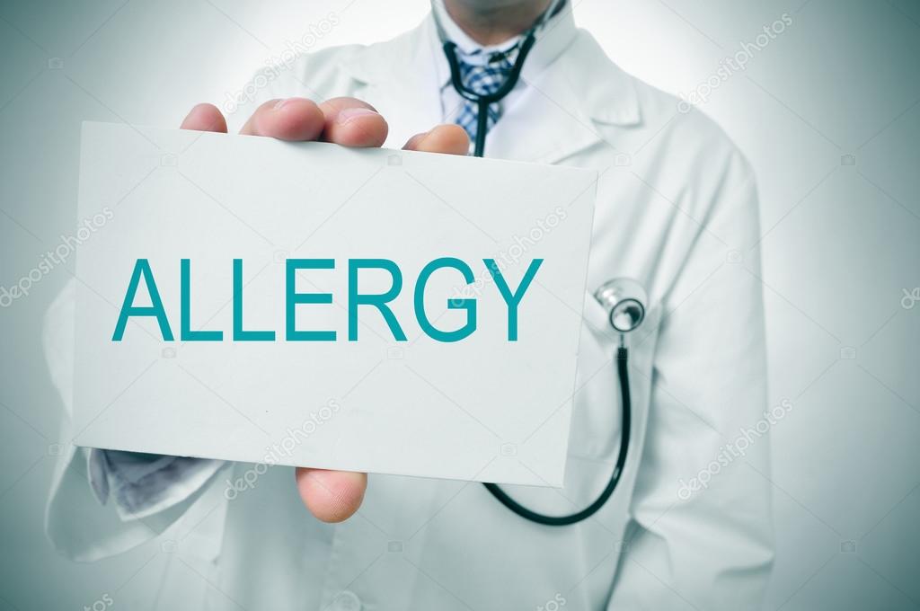 doctor showing a signboard with the word allergy