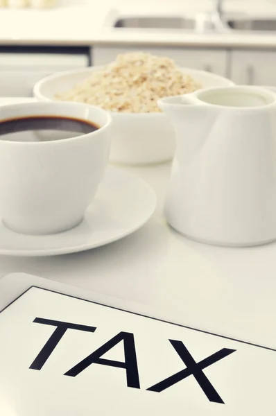Tax written in the screen of a tablet — Stock Photo, Image