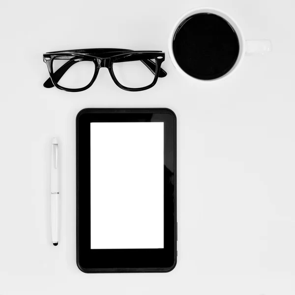 Eyeglasses, tablet computer and cup of coffee — Stock Photo, Image