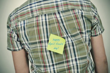 man with a sticky note with the text happy april fools day clipart