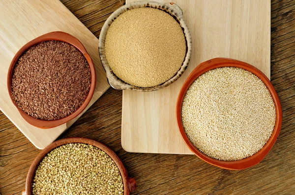 Amaranth, quinoa, brown flax and buckwheat seeds — Stock Photo, Image