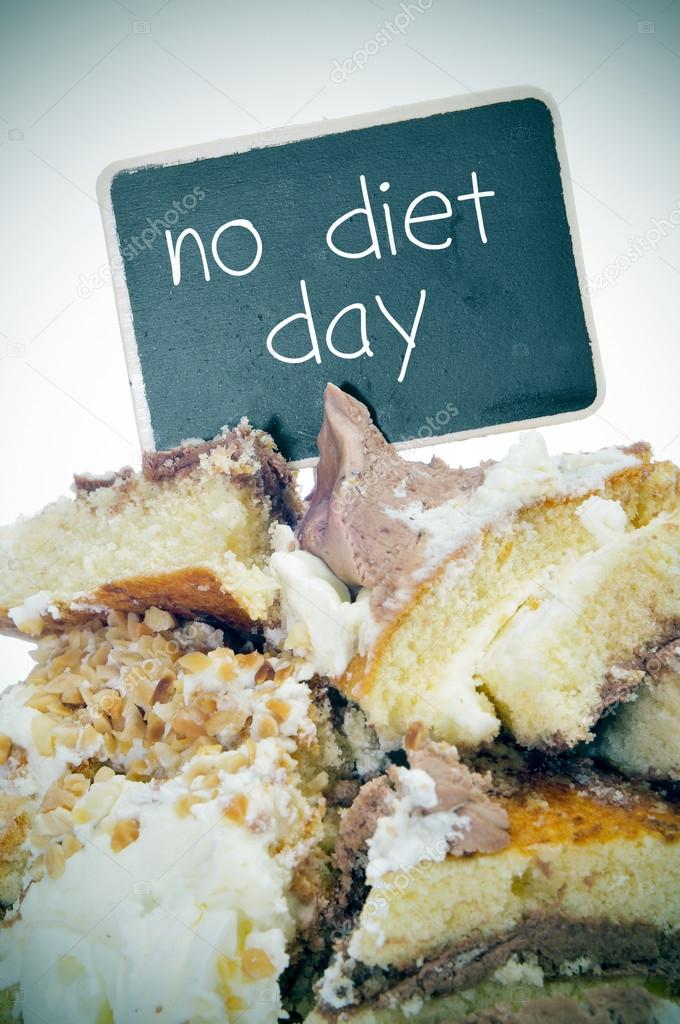 pieces of cake and text no diet day on a signboard
