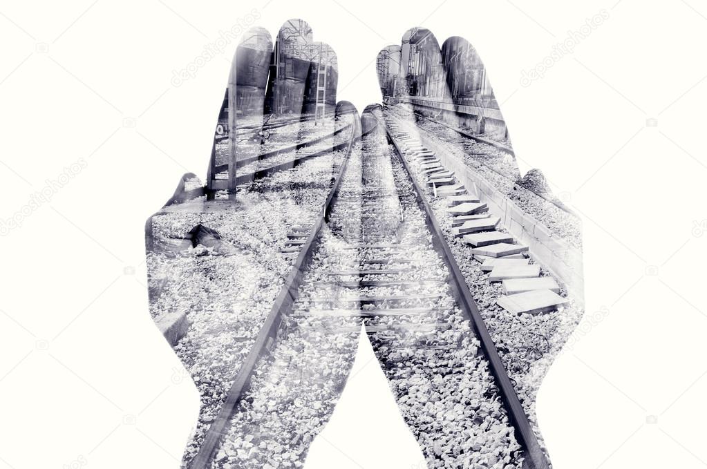 double exposure of man hands and railway, in black and white