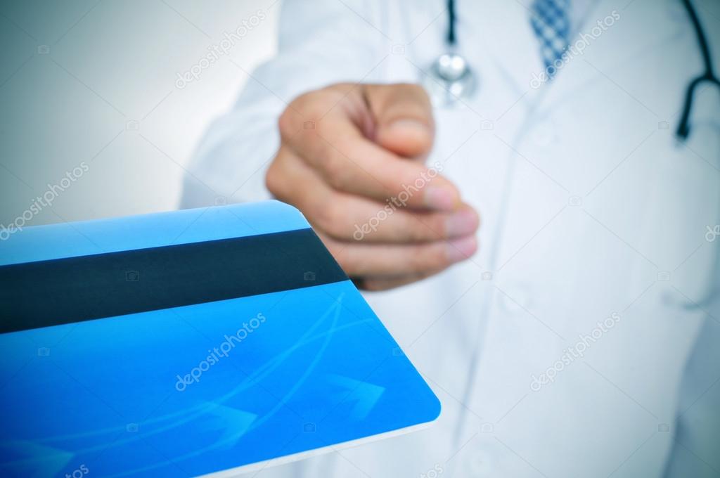 doctor accepting a credit card