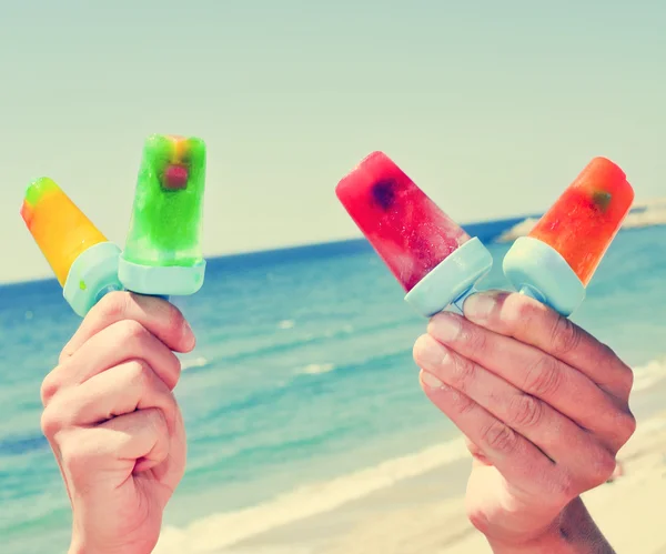 Homemade ice pops on the beach, with a filter effect — Stock Photo, Image