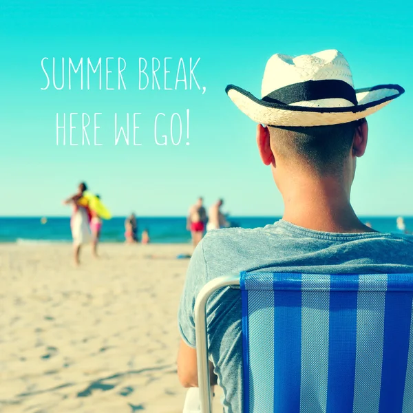 A young man on the beach and the text summer break, here we go — Stock Photo, Image