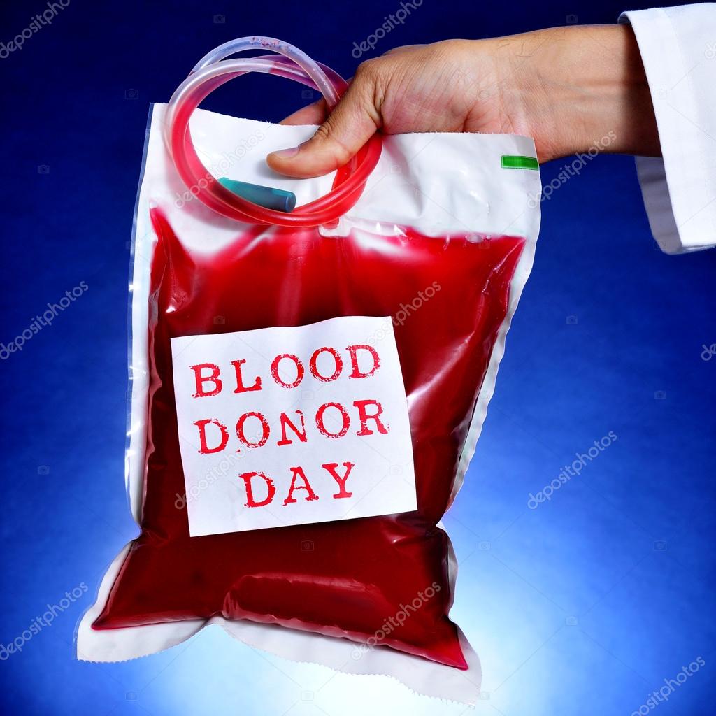 doctor holding a blood bag with the text blood donor day