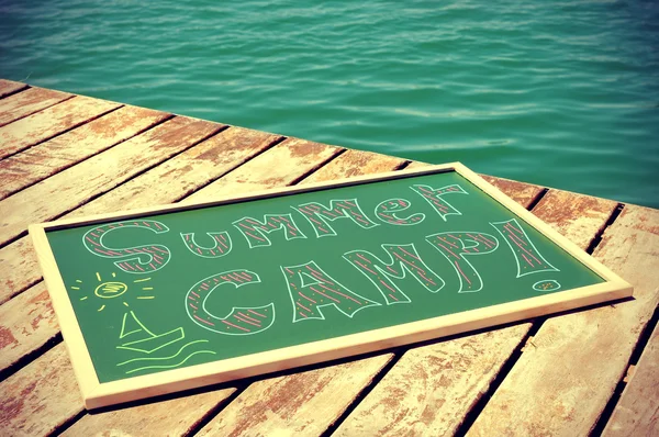 Text summer camp written in a chalkboard — Stock Photo, Image