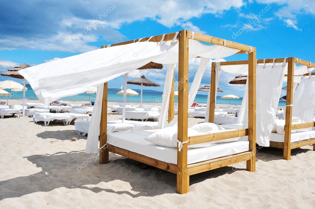 beds and sunloungers in a beach club in Ibiza, Spain