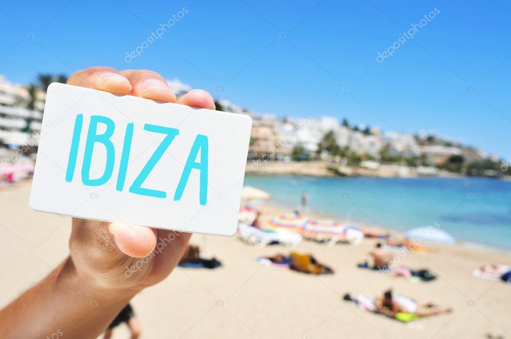 Man with a signboard with the word Ibiza