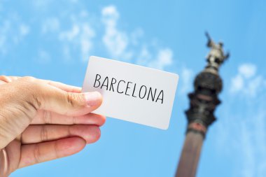 signboard with the text Barcelona, with the Columbus Monument in