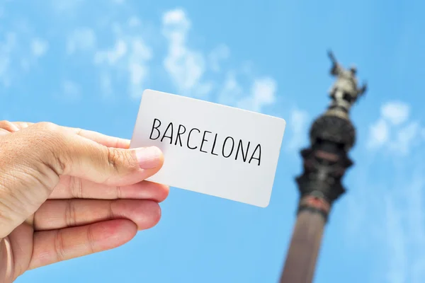 Signboard with the text Barcelona, with the Columbus Monument in — Stock Photo, Image