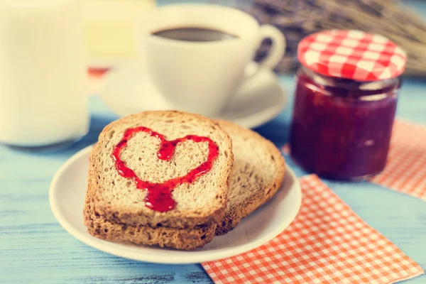 Heart of jam on a toast, with a cross-process effect — Stock Photo, Image