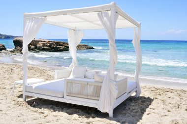 white bed in a beach club in Ibiza, Spain clipart