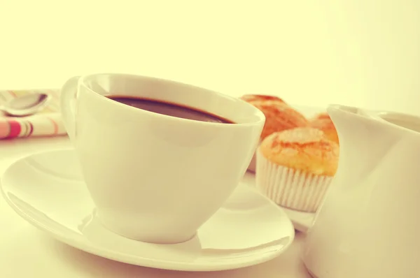 Coffee and magdalenas, typical spanish plain muffins, with a fil — Φωτογραφία Αρχείου