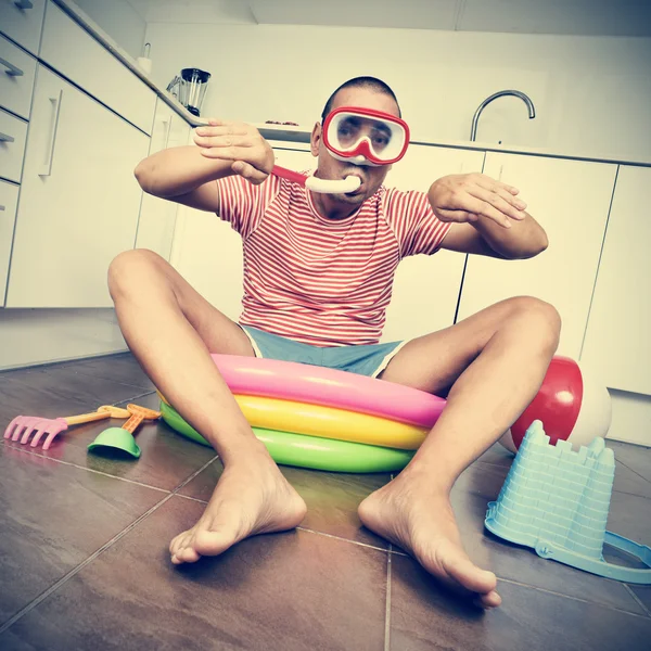 Man swimming in an inflatable water pool, indoors, with a dramat — Stock Photo, Image