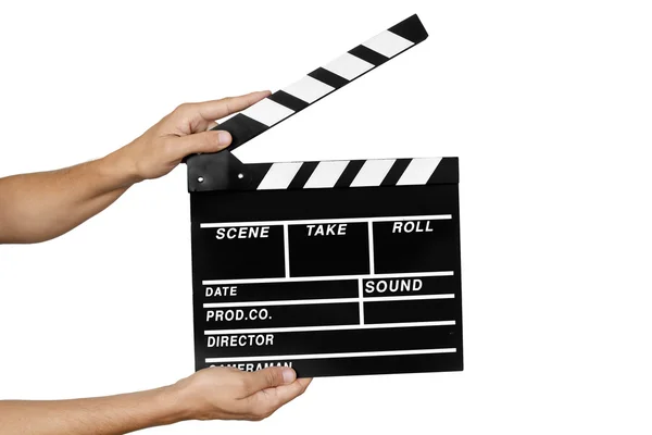 Young man with a traditional wooden clapperboard — Stockfoto