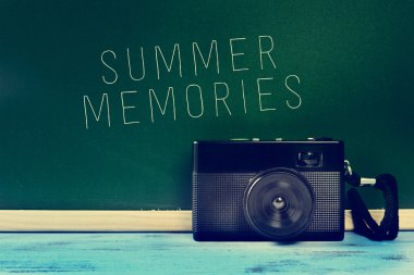 Retro camera and the text summer memories clipart