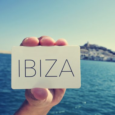 Man with a signboard with the word Ibiza, in Ibiza Town clipart