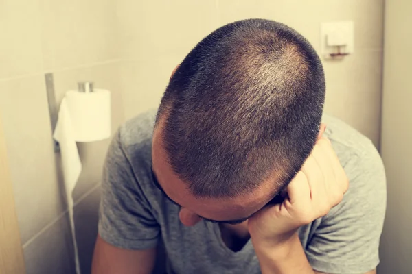 Man in the toilet — Stock Photo, Image