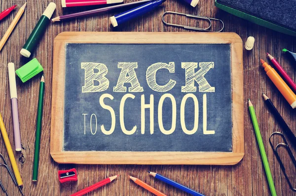 The text back to school written on a chalkboard — Stock Photo, Image