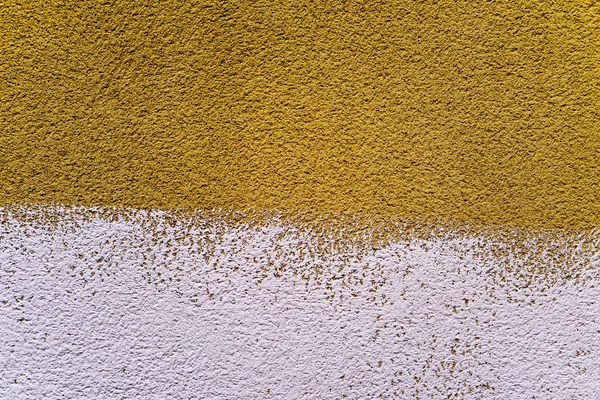 Dark yellow and white rustic plastered wall — Stock Photo, Image