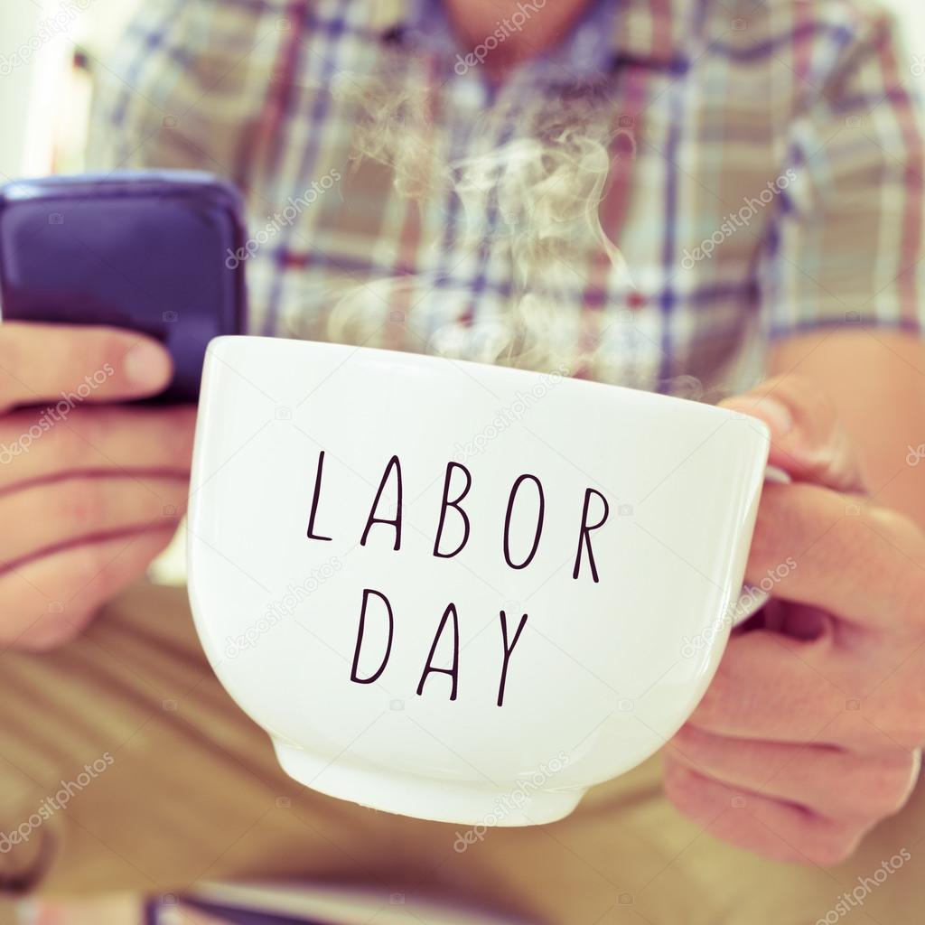 young man with a mug with the text labor day