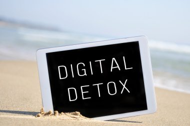 Text digital detox in a tablet computer clipart