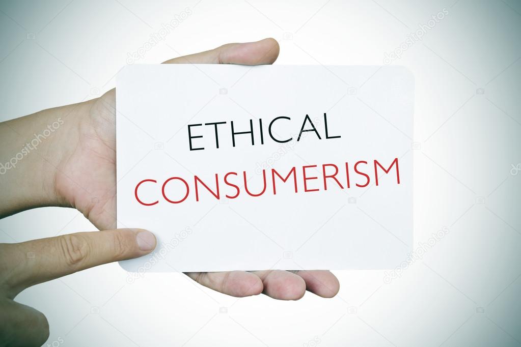 Man with a signboard with the text ethical consumerism