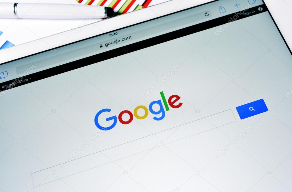BARCELONA, SPAIN - SEPTEMBER 2, 2015: A tablet computer with the Google Web Search homepage in its screen with the new Google logo, launched in September 1