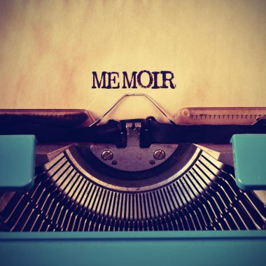 retro typewriter and word memoir written with it clipart
