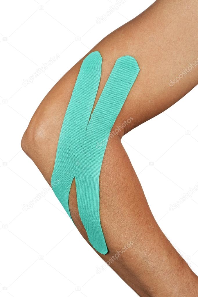 young man with an elastic therapeutic tape in his arm