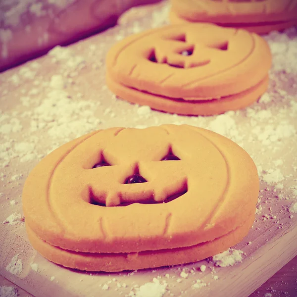 Cookies in the shape of jack-o-lanterns, vignetted — Stock Photo, Image