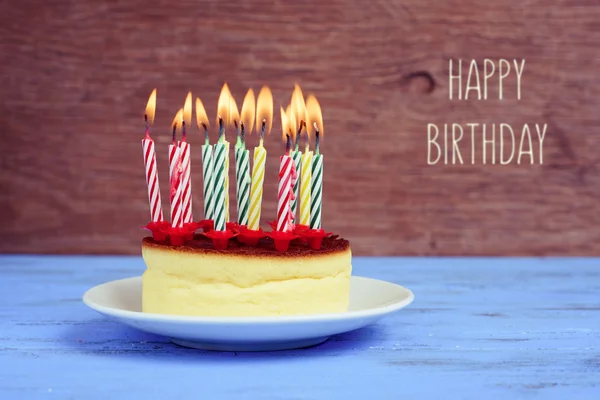 Text happy birthday and cheesecake with candles — Stock Photo, Image