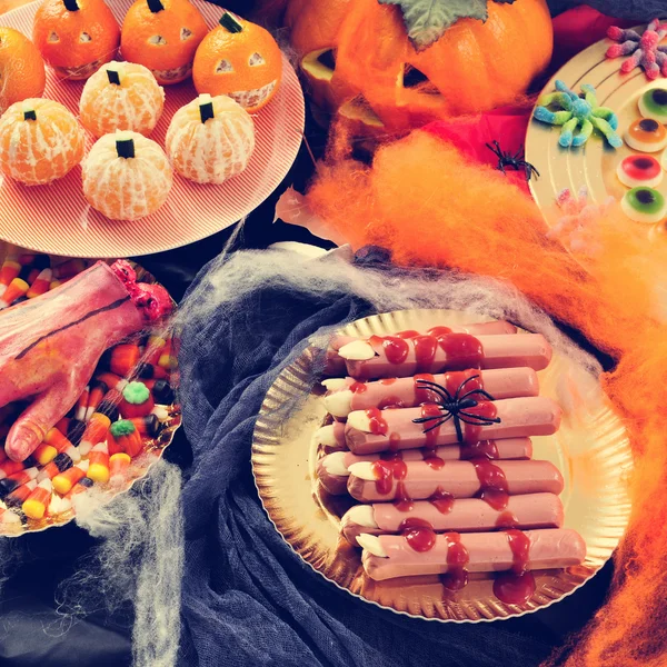 Halloween food, such as scary fingers and candies — Stock Photo, Image