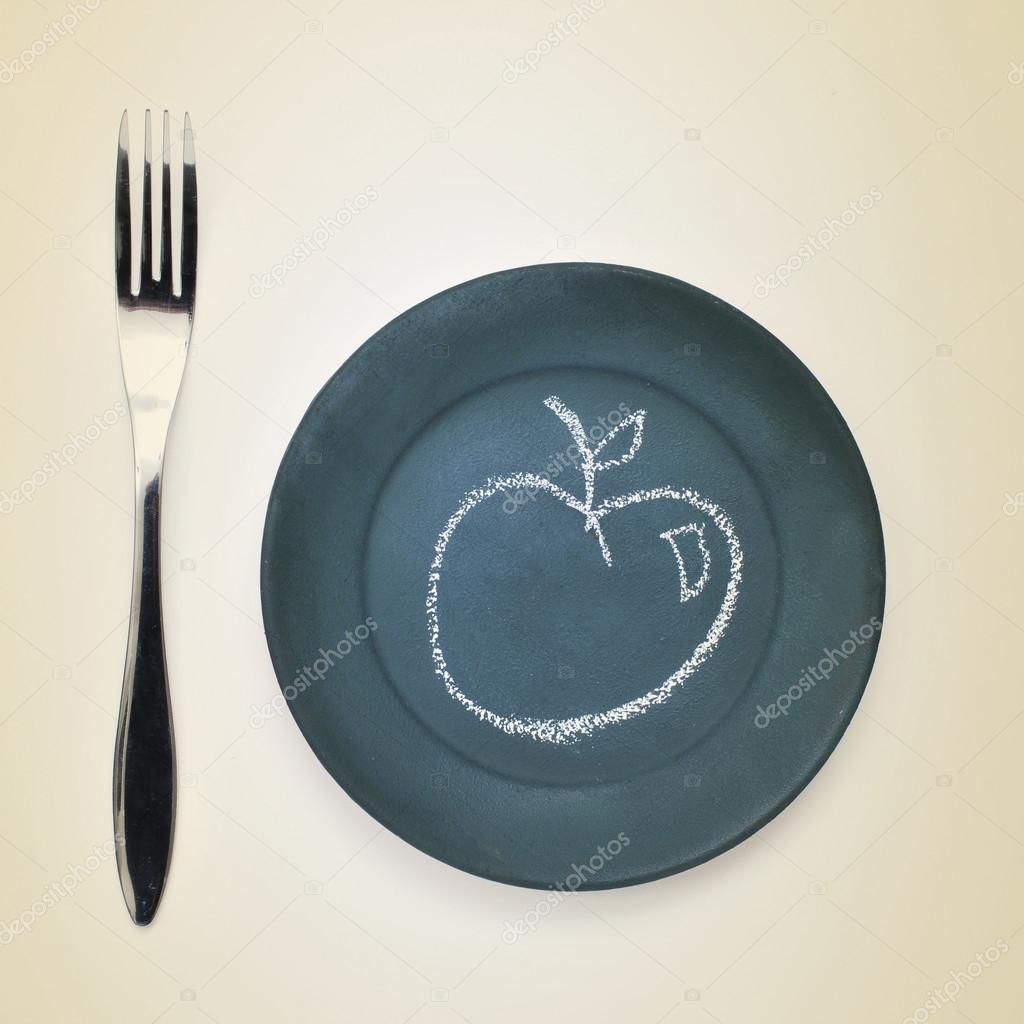 apple drawn with chalk in a plate