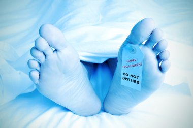 dead body with a toe tag with the text happy halloween clipart