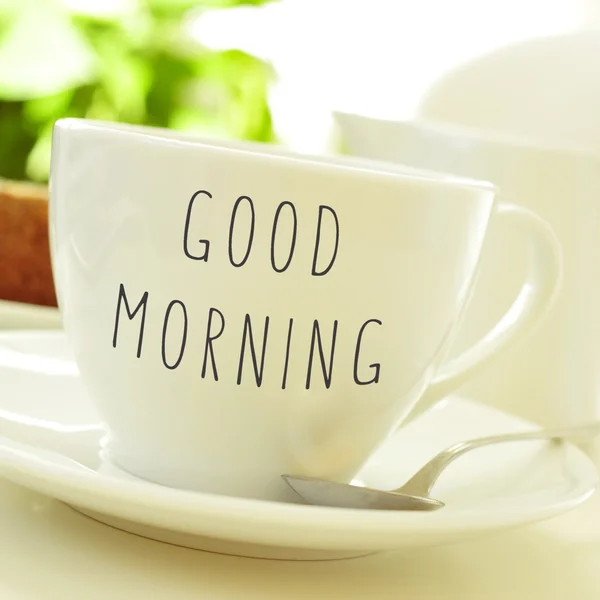 Text good morning on a cup of coffee or tea — Stock Photo, Image