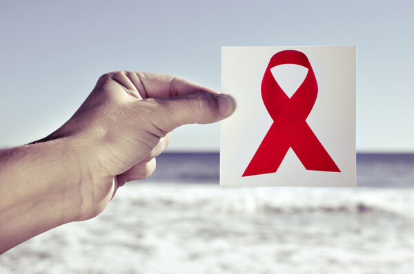 young man with a picture of a red ribbon