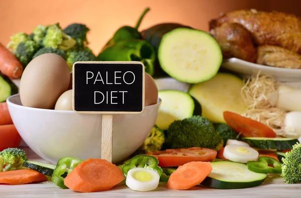 Eggs, chicken, vegetables and text paleo diet — Stock Photo, Image