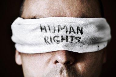 young man with a blindfold with the text human rights clipart