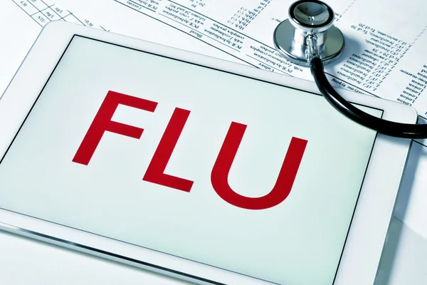 Palabra gripe en una tableta — Foto de Stock